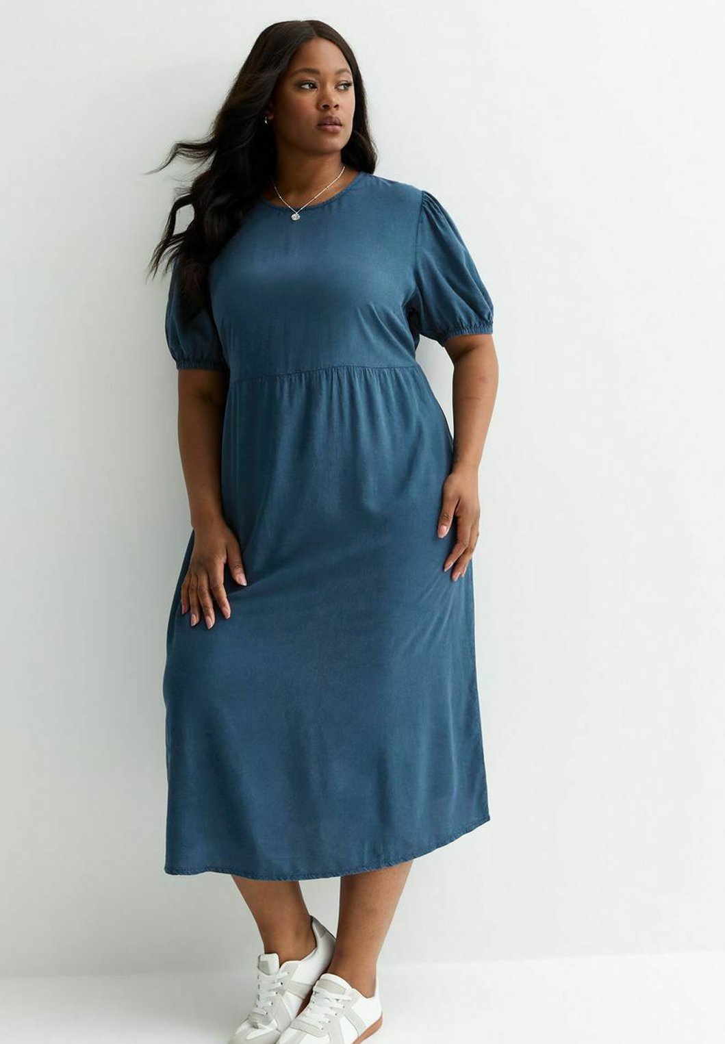 knee length dresses for ladies Buy Women Blue Floral Smocked Midi Dress Online at Best Price main image 1