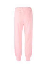 Rosa Jogginghose aus weichem Stoff mit elastischem Bund und schmal zulaufenden, gesäumten Bündchen an den Knöcheln. Glatte Textur mit minimalen Designdetails.