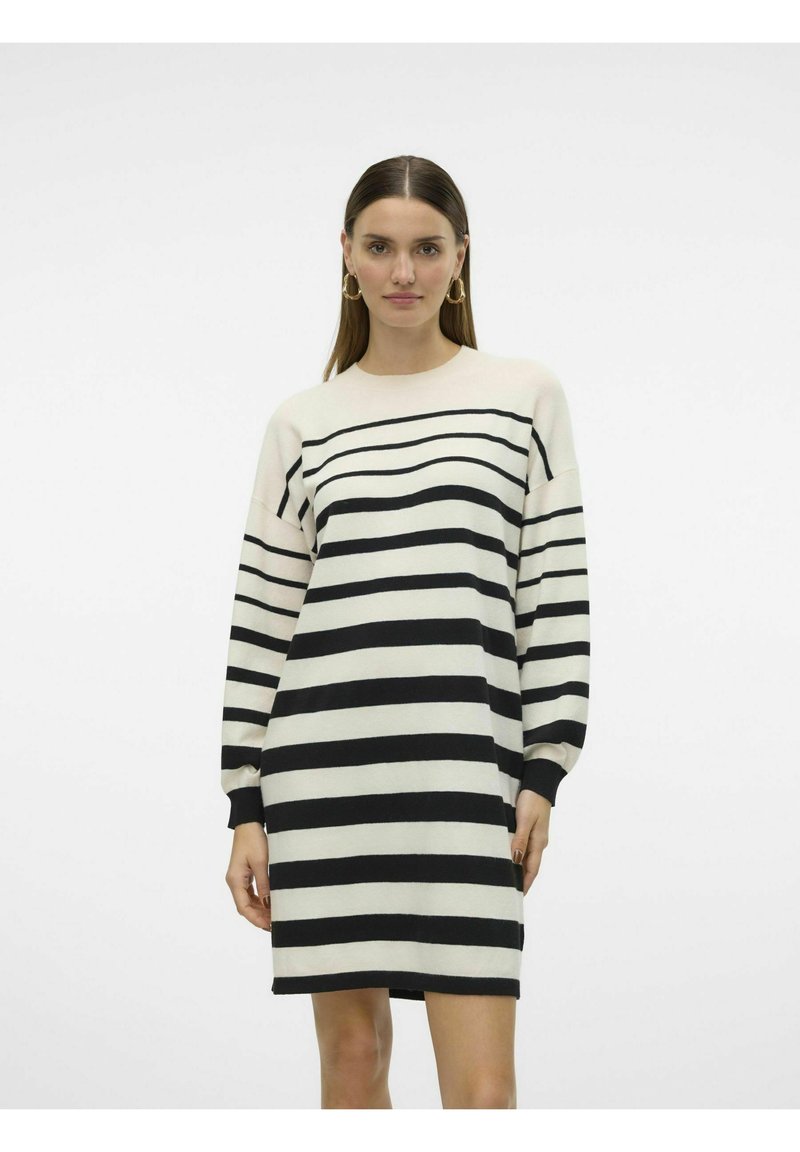 Abito a maglia a righe con strisce orizzontali nere e crema, maniche lunghe, scollo rotondo e vestibilità rilassata. Tessuto morbido e lunghezza a metà coscia.