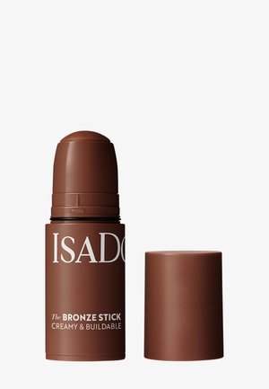 Brown IsaDora Bronze Stick Make-up ohne Kappe, zeigt die abgerundete Spitze für eine cremige und schichtbare Anwendung.