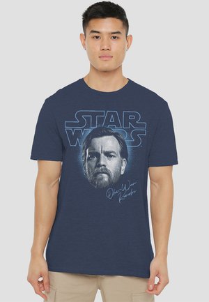 Navy t-shirt featuring a graphic of Obi-Wan Kenobi's face with "STAR WARS" text. Soft texture, short sleeves, and classic crew neckline.