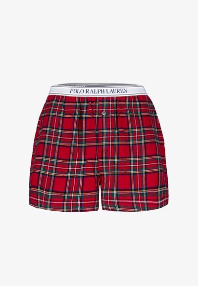 Punaiset ruudulliset bokserit, joissa valkoinen joustava vyötärönauha "POLO RALPH LAUREN" -logolla, yksittäinen nappisuljin ja pehmeä kangaspinta.