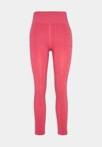 Różowe legginsy do kostek z wysokim stanem, charakteryzujące się bezszwowym krojem i teksturowanymi akcentami w pobliżu dołu. Miękki, elastyczny materiał.