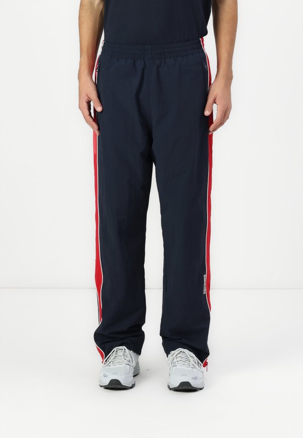 WINDBRAKER PANT - Tracksuit bottoms - daring ocean