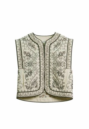 Vestă crem matlasată, cu broderii florale negre și modele în spirală, cu decolteu rotund și front deschis.