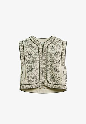 Krém színű steppelt mellény fekete virágos hímzéssel és örvénymintákkal, kerek nyakkivágással és nyitott elejű kialakítással.