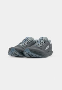 Gray athletic shoes with mesh upper, rubber sole, contrasting light blue accents, and textured detailing on the toe and heel areas.