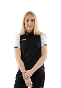 Polo shirt bianco e nero a maniche corte, con colletto e il logo "JAKO" sul petto. Il materiale appare liscio e sportivo.