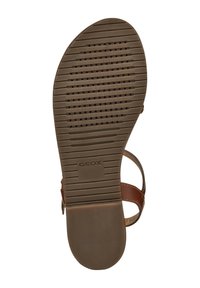 Semelle de sandale Geox marron en caoutchouc texturé pour une bonne adhérence, avec des rainures horizontales et des trous de ventilation, marquée "Geox."