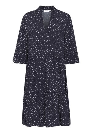 Marineblaues knielanges Kleid mit weißem Herzmuster, dreiviertellangen Ärmeln, gerafften Manschetten, gestuftem Rock und V-Ausschnitt.