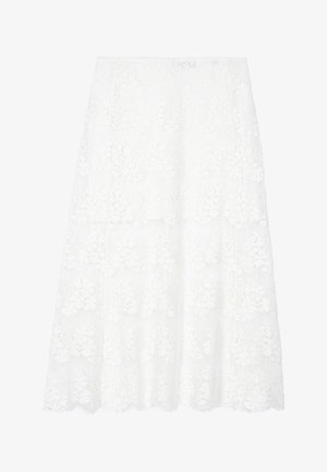 Jupe en dentelle blanche avec un design superposé, présentant des motifs floraux et un ourlet en vagues. Fabriquée en tissu léger et texturé.