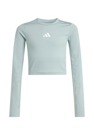 Top corto de manga larga en azul claro hecho de tela suave, con un logo blanco en el pecho y aberturas en los puños.