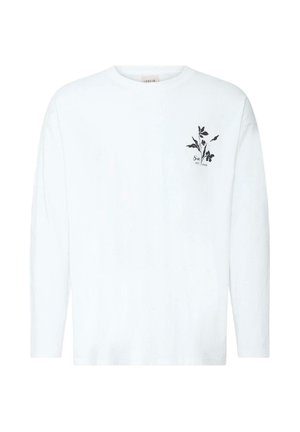 Chemise blanche à manches longues avec un petit motif floral noir et texte sur la zone gauche de la poitrine, col rond, fond uni.