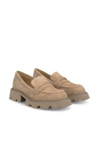 Beige suede loafers with a chunky rubber sole, featuring a distinctive stitched panel across the vamp and a rounded toe.