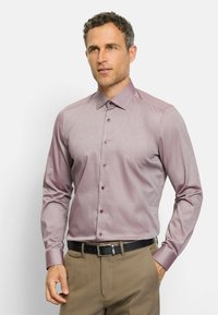 Long-sleeve dress shirt in mauve with a subtle check pattern, button-down collar, and matching buttons, paired with khaki trousers and a black belt.
