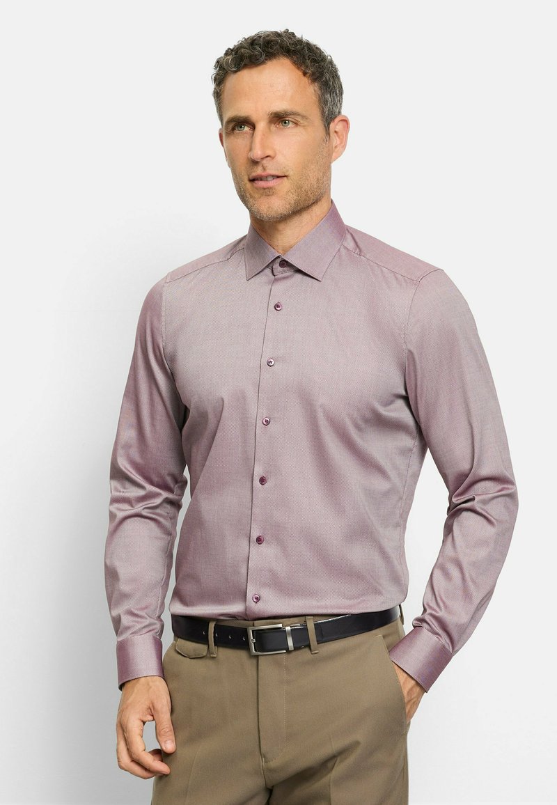 Long-sleeve dress shirt in mauve with a subtle check pattern, button-down collar, and matching buttons, paired with khaki trousers and a black belt.