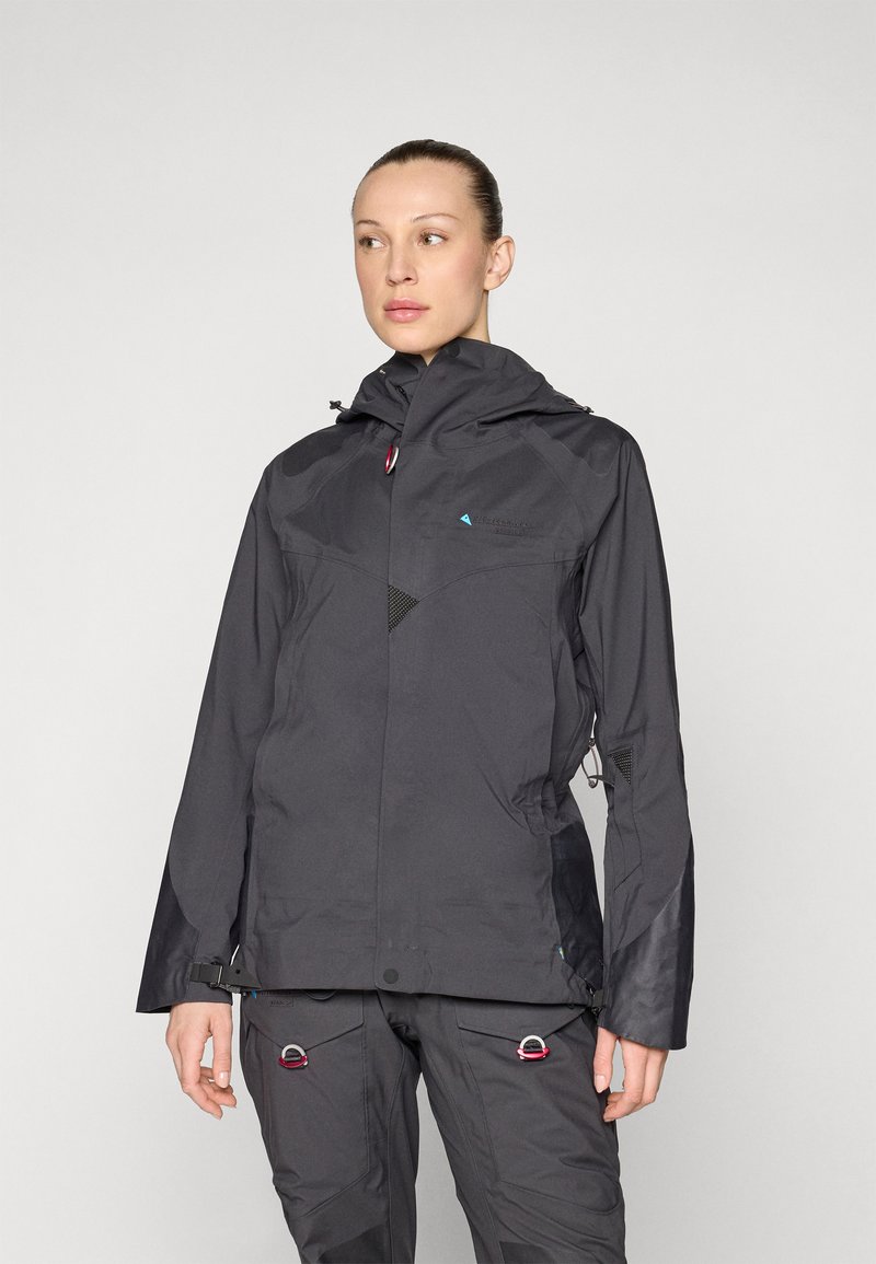 Black waterproof jacket featuring a hood, zippered pockets, and adjustable cuffs. Lightweight material with a sleek design and mesh accents.