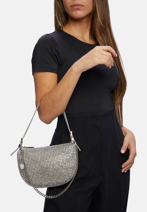 Vero Moda's Toteme jas met sjaal lookalike is de perfecte tussenjas