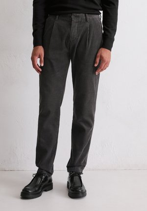 Gray corduroy trousers with a straight-leg design, featuring front pleats and a flat front. Paired with black leather shoes.