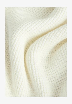 Tkanina z waflasto neoblikovanjem v mehki beli barvi, ki prikazuje dvignjen mrežni vzorec, z gladkim, rahlo puhastim videzom in blagim padcem.