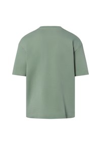 Relaxed-fit short-sleeve t-shirt in light green cotton. Features a crew neck and seamless shoulders, with a smooth, soft texture.