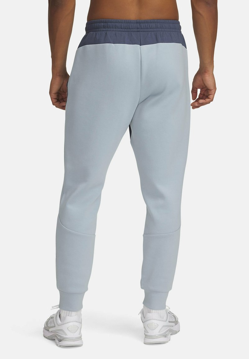 Under Armour UNSTOPPABLE FLEECE Pantaloni sportivi downpour