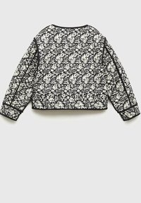 Krótkie żakiet w kwiatowy wzór w kolorach czarnym i kremowym, z długimi rękawami i kontrastującym czarnym obszyciem przy kołnierzu i mankietach.