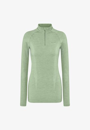 Maglietta sportiva a maniche lunghe di colore verde chiaro in un tessuto morbido, con colletto a mezza zip e dettagli a motivo testurizzato lungo le braccia e i fianchi.