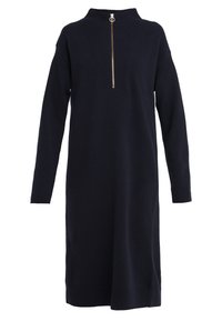 Mörkblå stickad klänning med långa ärmar, hög krage och halv dragkedja framtill. Har ribbade detaljer vid kragen, ärmarna och fållen.