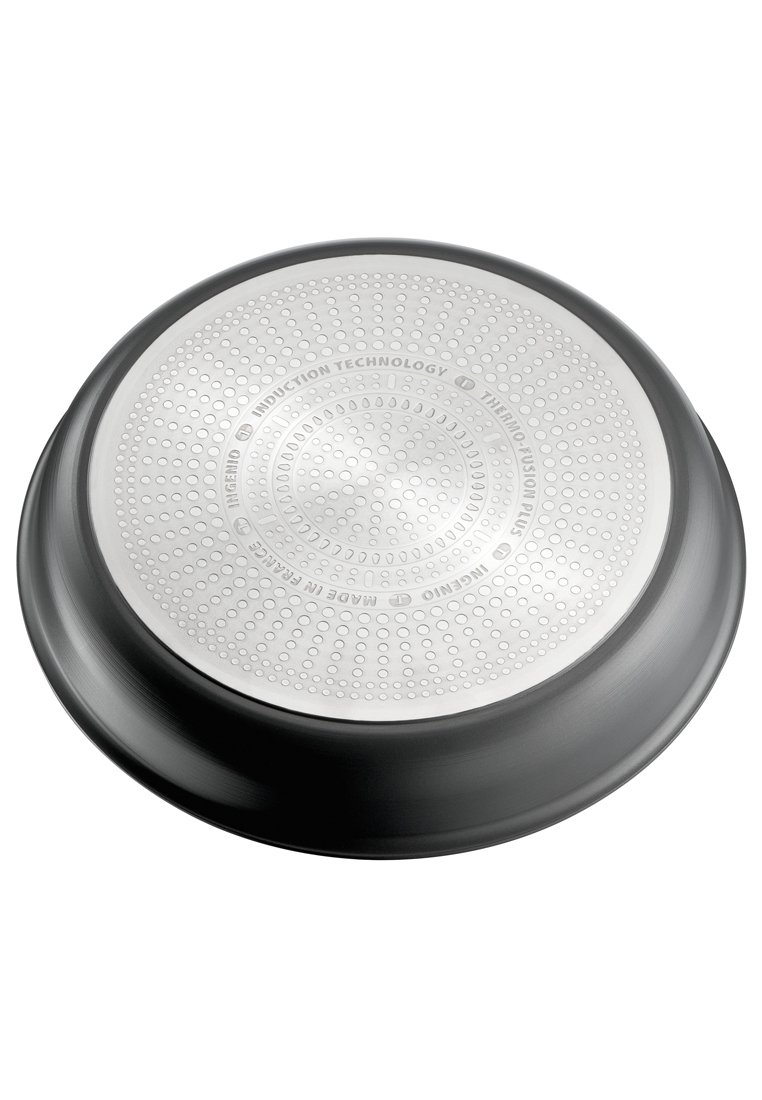 Edelstahlbratpfanne mit glatter, silberner Oberfläche, kreisförmiger Form, strukturiertem Boden und grau-schwarzem antihaftbeschichtetem Rand.