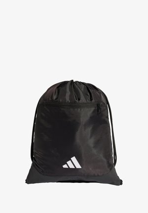 Mochila negra con cordón, hecha de tela suave, que cuenta con un bolsillo frontal con cremallera y un detalle de logo blanco en la esquina inferior.
