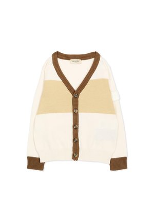Cárdigan de punto en crema y beige con botonera marrón, cuello y puños, con cinco botones de carey y una pequeña parche blanca en la manga.