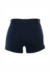 Boxer en bleu marine en mélange de coton doux, avec un design ajusté, une large ceinture élastique et un imprimé graphique sur le côté.