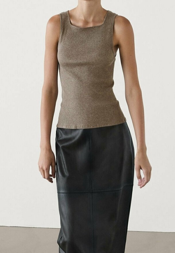 Brown ribbed tank top paired with a black leather midi skirt. The top has a square neckline; the skirt features a smooth texture and visible seams.
