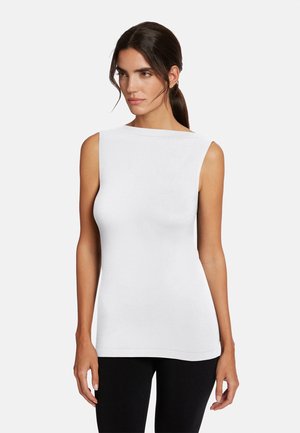 White sleeveless top with a boat neckline, smooth texture, and a fitted design, paired with black leggings. Simple and minimalistic style.