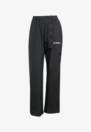 Mustad mustad Terrex püksid, millel on nööriga piht, külgne lukuga tasku ja stiilne, kitsenev disain, sobilik välistingimustes tegevusteks.