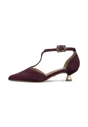 Zapato de mujer bajo de ante morado con punta puntiaguda, tira en T y hebilla decorativa con joyas en la tira del tobillo.