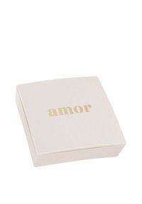 Square, light pink box with a smooth texture and gold "amor" text on the top. The lid is slightly raised, and corners are rounded.