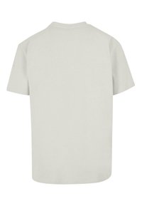 Lys grå bomulds T-shirt med korte ærmer, rund hals og en ensfarvet ryg. Blød tekstur og et afslappet fit design. Ingen mønstre eller detaljer.
