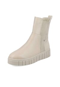 Botas de tobillo beige con acabado de cuero suave, paneles laterales elásticos y suela de goma texturizada, con una lengüeta para ponerlas fácilmente.