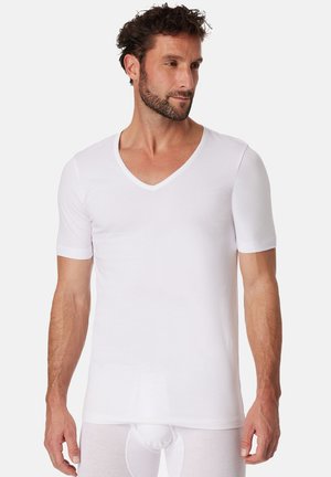 White cotton V-neck t-shirt with short sleeves, form-fitting design, smooth texture, and minimal stitching details.