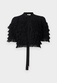 Giacca nera cropped con maniche in chiffon arricciate, con scollatura rotonda e chiusura frontale con nodo e dettagli in hardware dorato.