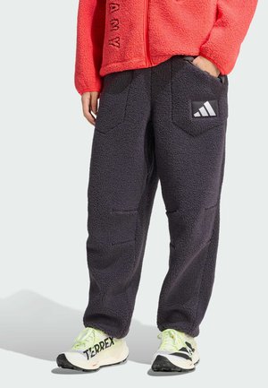 - Spodnie materiałowe