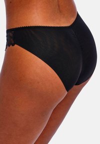 Zwarte, doorschijnende bikini slip met kantafwerking bij de tailleband; heeft een gladde textuur en een klassieke snit.