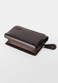 Black leather wallet with a zipper closure, textured surface, slight sheen, and embossed logo on the front. Compact and rectangular design.