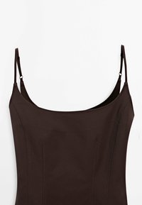 Sleeveless dark brown dress with a rounded neckline, adjustable straps, and subtle side stitching details. Smooth, matte fabric texture.
