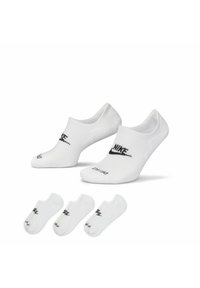 Calcetines Nike blancos de tobillo con logo negro, textura suave y diseño bajo. Incluye cuatro pares, todos con el mismo esquema de color.