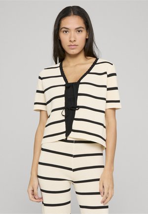 Gestreiftes Oberteil in Creme und Schwarz, mit kurzen Ärmeln, V-Ausschnitt und einer Bindeschleife vorne, gefertigt aus strukturiertem Stoff.