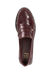 Burgundy leather loafer with textured finish, decorative upper band, and black rubber outsole. Gold accent logo on insole.