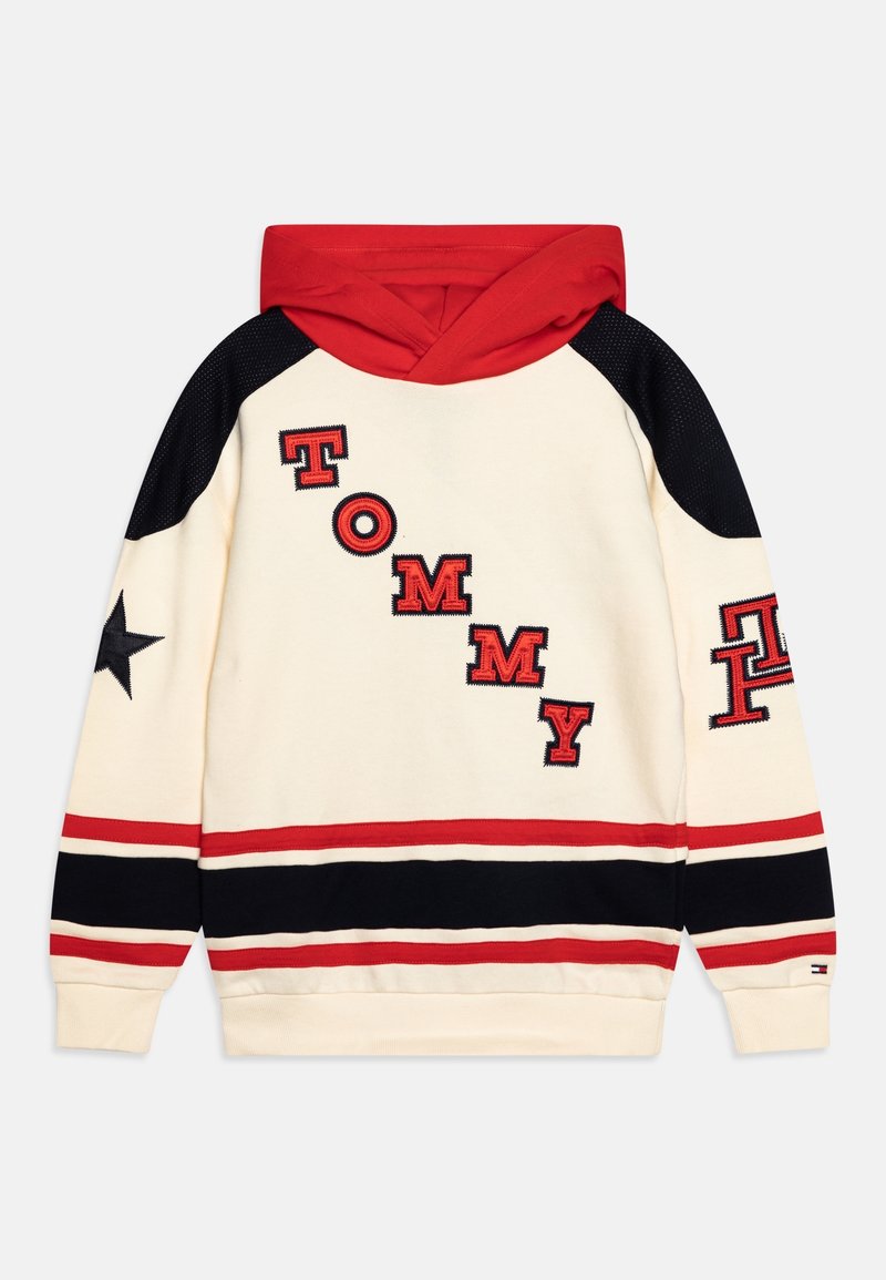 Felpa con cappuccio crema con accenti rossi e neri, caratterizzata da lettere ricamate "TOMMY" e dettaglio a stella sulla manica. Tessuto in misto cotone.